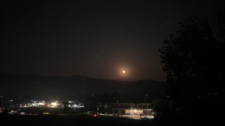 Time lapse of a moon rising early autumn 