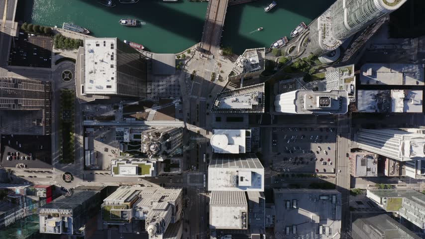 Aerial view of downtown Chicago skyscrapers, the Chicago River, and urban streets in Chicago, Illinois, United States.