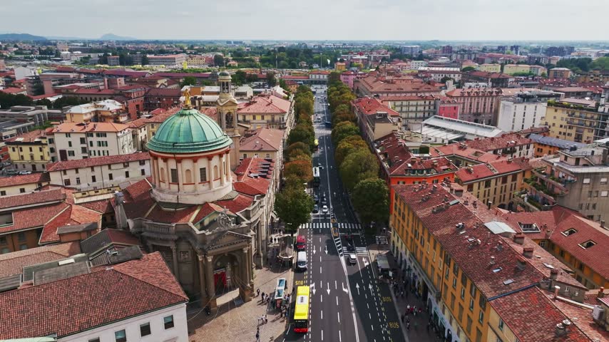Aerial drone view of Bergamo Railway Station, Stazione di Bergamo, Italy, showcasing the major transport hub, railway infrastructure, surrounding urban landscape, and city center.