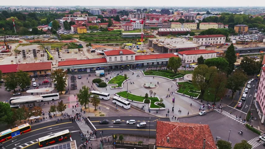 Aerial drone view of Bergamo Railway Station, Stazione di Bergamo, Italy, showcasing the major transport hub, railway infrastructure, surrounding urban landscape, and city center.