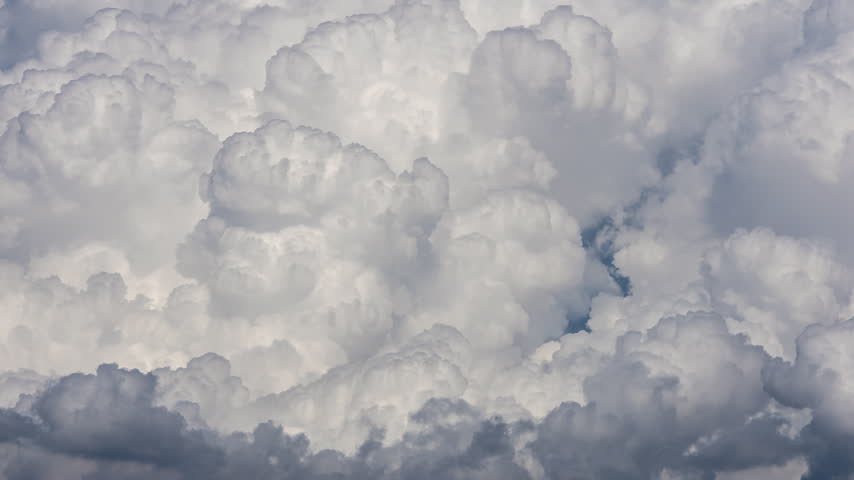 Close up of clouds moving in timelapse as storm builds over the mountains in Utah.