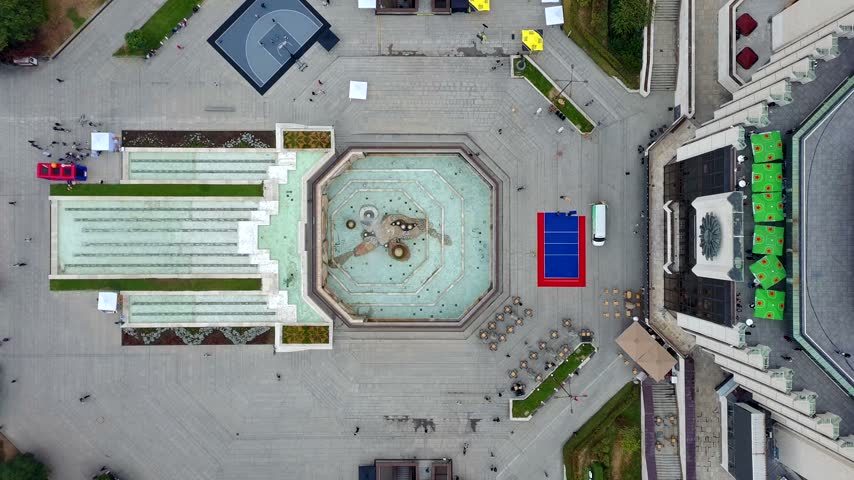 Aerial view of the National Palace of Culture square with its large fountain, paved plaza, and surrounding urban architecture in Sofia, Sofia City Province, Bulgaria.