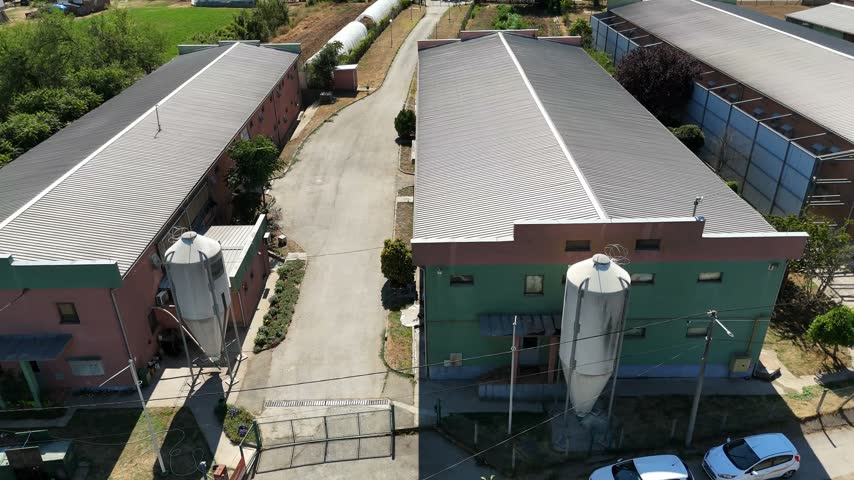 Aerial view of chicken farm with industrial buildings and silos in Mladenovac, City of Belgrade, Serbia.