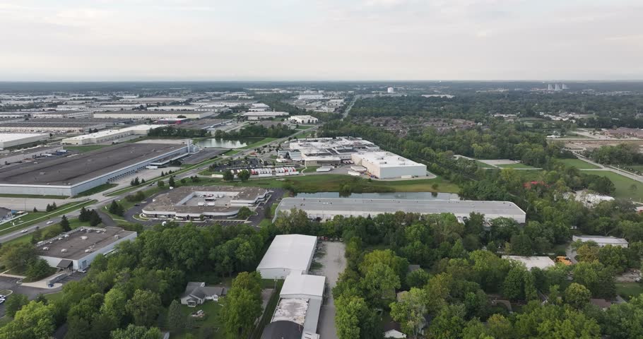 Aerial view of industrial park with warehouses and office buildings surrounded by trees in Indianapolis, Indiana, United States.