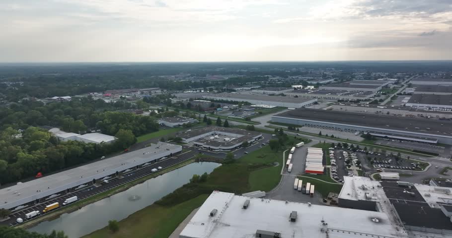 Aerial view of large industrial warehouses and logistics centers with parking lots and trucks in Indianapolis, Indiana, United States.