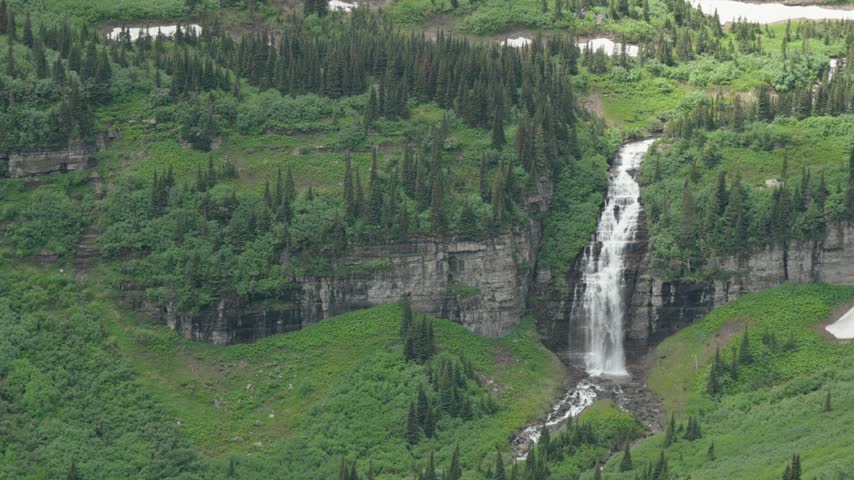 Bird woman falls cascading down a cliff in glacier national park montana