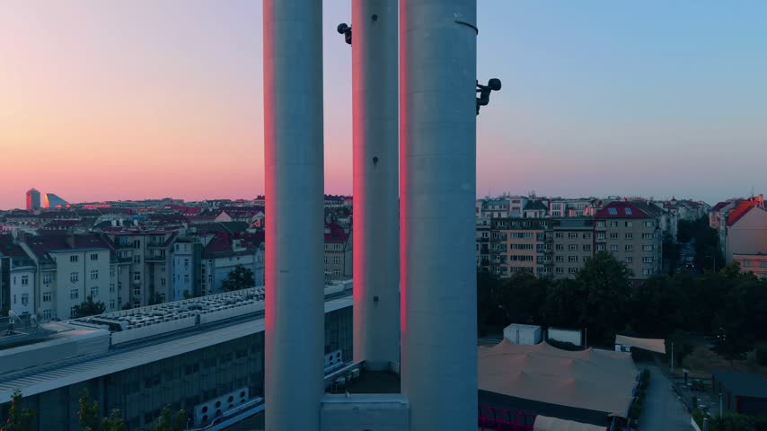 Aerial view of Zizkov Television Tower with its iconic crawling baby sculptures, overlooking the cityscape of Prague, Hlavni mesto Praha, Czechia.