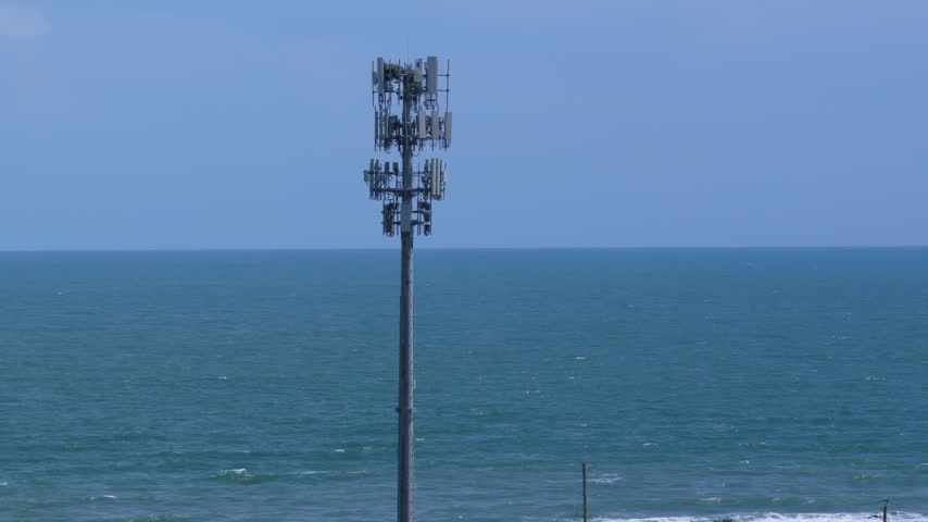 Aerial view of a telecommunications cell tower situated along the coastline at Summer Haven in St. Johns County, Florida, United States.