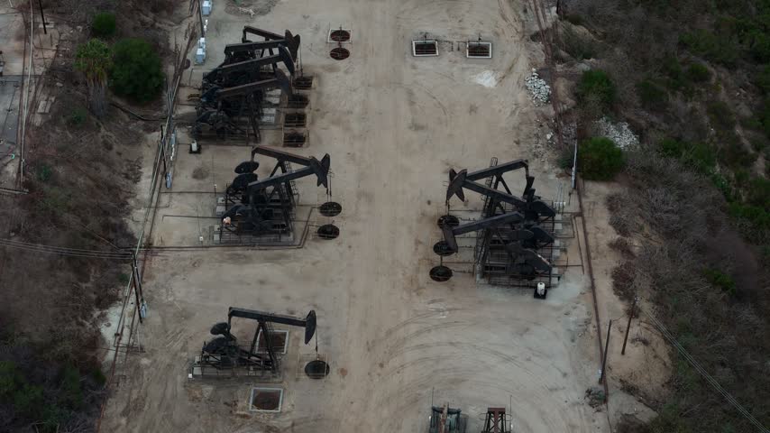 Aerial view of oil pump jacks operating in the Baldwin Hills oil field in Los Angeles, California, United States.