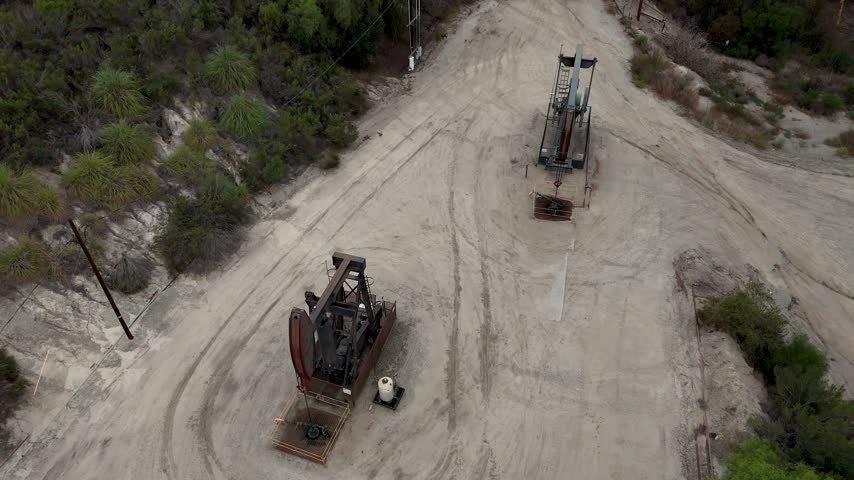 Aerial view of oil pump jacks operating in the Baldwin Hills oil field in Los Angeles, California, United States.
