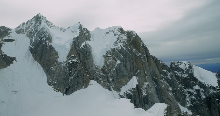 Aerial view of the rugged snow-capped peaks and glaciers of Mount McKinley in Denali Borough, Alaska, United States.