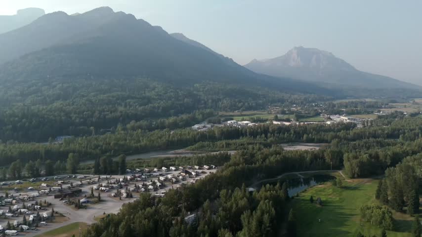 Motorhomes At Fernie RV Resort With Mountains In The Background In BC, Canada. -aerial shot