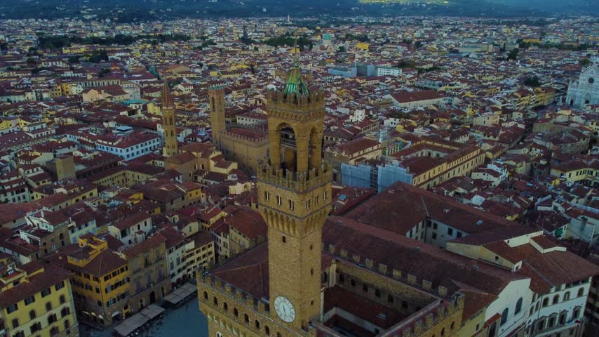 Aerial view of Palazzo Vecchio tower rising above the historic rooftops of Florence, Firenze, Toscana, Italy.