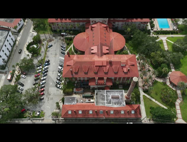 Aerial view of the historic Lightner Museum with its distinctive red roofs, courtyard, and surrounding gardens in St. Augustine, Florida, United States.