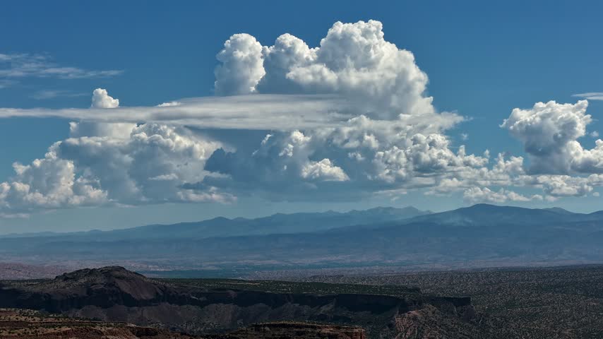 Aerial view of monsoonal storm clouds forming over the southern Rocky Mountain range in White Rock, NM, United States.