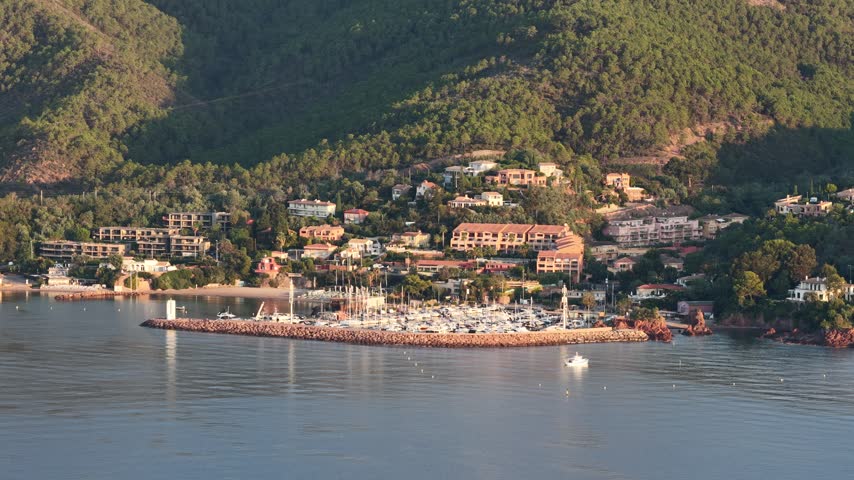 Aerial view of Le Trayas marina with boats and residential buildings nestled in the hills of Saint-Raphael, Provence-Alpes-Cote d