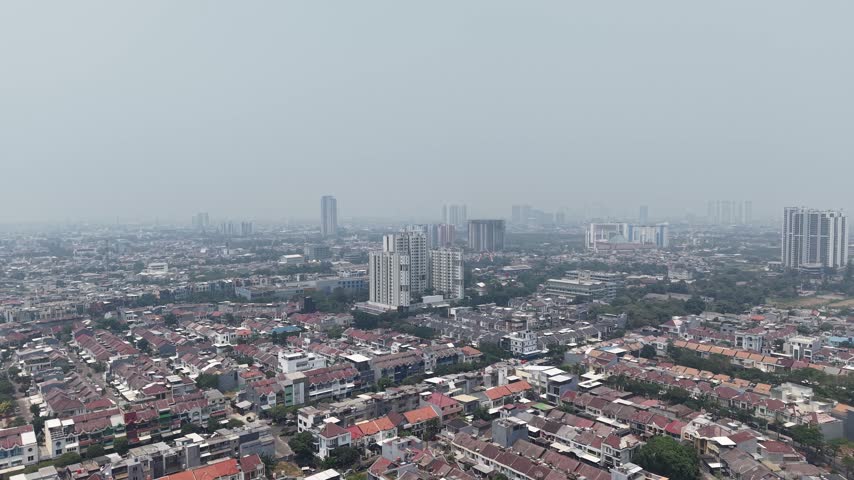 Aerial view of the dense urban landscape and high-rise buildings in Jakarta, Jakarta, Indonesia.