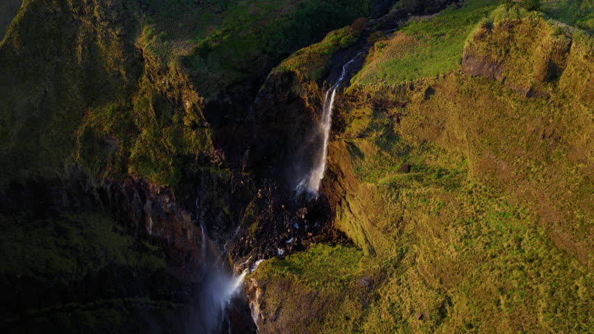 Cascata da Ribeira Grande Plunges Through Lush Volcanic Landscape On Flores Island In The Azores, Portugal. Aerial Top-down Shot