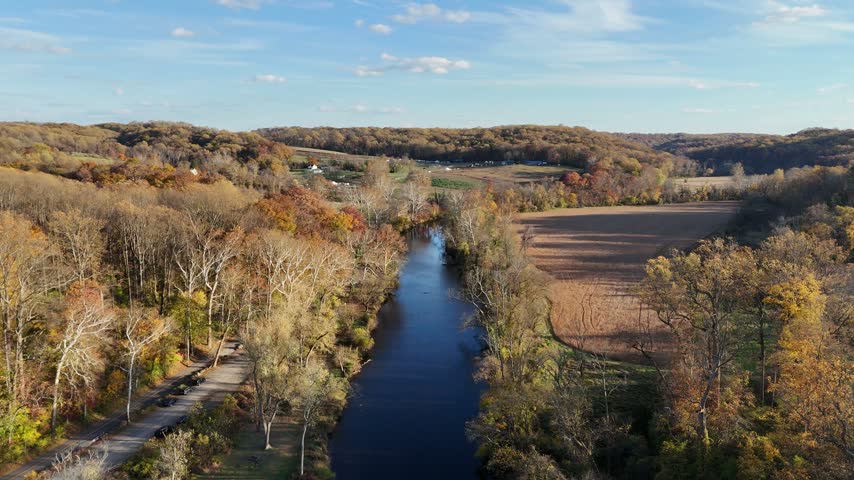 Aerial view of the Brandywine River winding through an autumn landscape near First State National Historical Park in Wilmington, Delaware