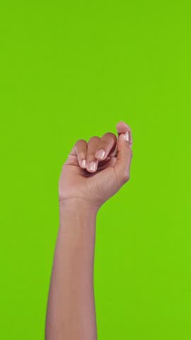African American woman rhythmically snaps fingers, creating a dynamic motion against a solid green screen. Precise finger movements suggest tempo and rhythm in this crisp, expressive performance