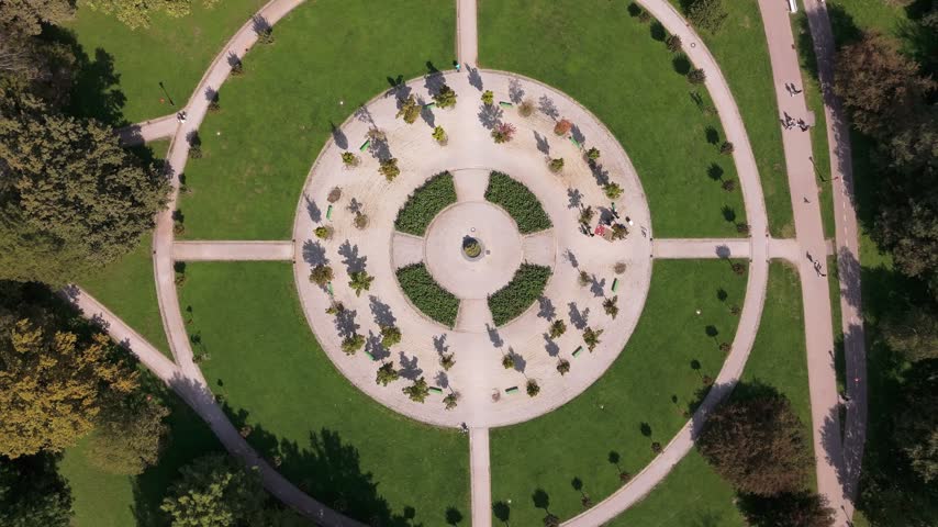 Aerial view of Tivoli Park with its circular pathways and green lawns in Ljubljana, Slovenia.