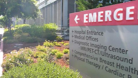 WASHINGTON HOSPITAL BUILDING - CIRCA 2013: Hospital entrance exterior with sign pointing to entrance.