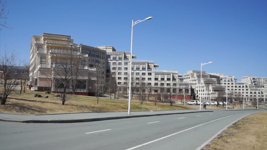 FEFU campus on Russky Island, Vladivostok, Russia, with modern university dormitory buildings and quiet surroundings.
