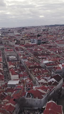 Scenic vertical aerial footage flying above Lisbon