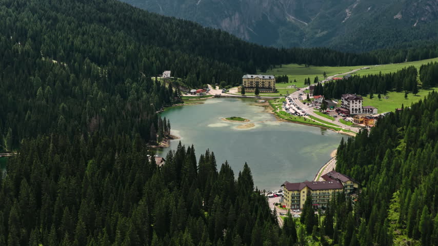 Aerial View Of Lake Misurina (Lago di Misurina) With Hotels, Pine Tree Forest And Mountain Landscape In Auronzo di Cadore, Belluno, Italy.