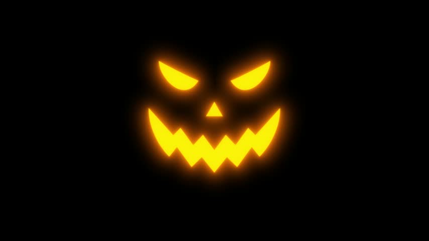 Pumpkin halloween animated jack o lantern face flashing rapidly on black background.   