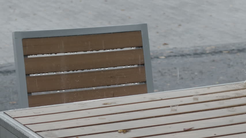 Rain falling on an outdoor rest area