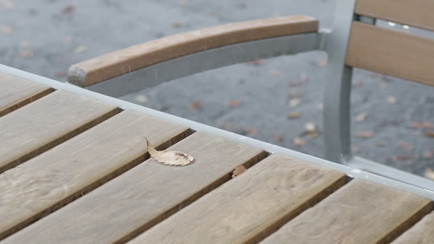 Rain falling on an outdoor rest area