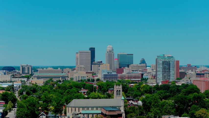 Louisville, Kentucky skyline. Featuring iconic landmarks like the domed 400 West Market building, historical architecture, and rich urban greenery, this clip is perfect for Southern travel vlogs.