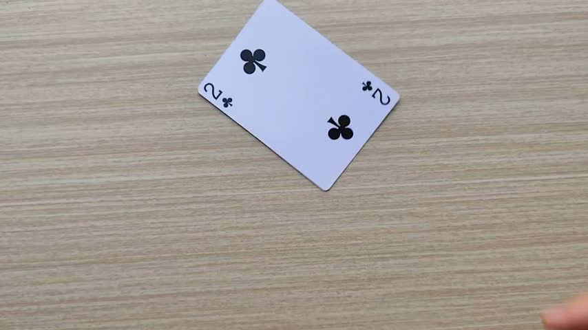 Dealing cards at the table, revealing the poker playing cards.