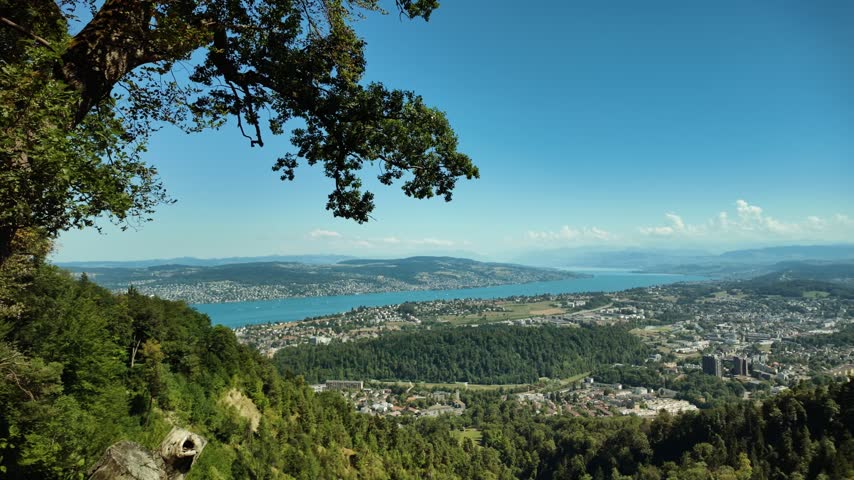 An aerial view of Lake Zurich and the surrounding lakeside towns, seen from the area of ​​Uetliberg Hill.