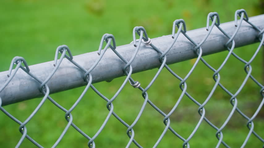 Metal Chain Link Fence Covered in Rain Video