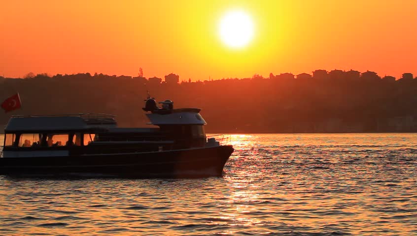 Pleasure boat cruising along coast of Bosporus Sea in Istanbul, Turkey. Tour
