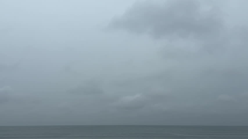 Rainy Sky with Thick Clouds and the Sea Horizon