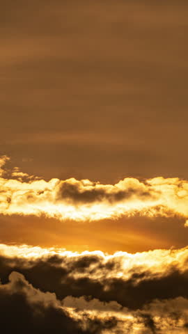 Peaceful sunrise time-lapse with warm golden light and fast-moving clouds.