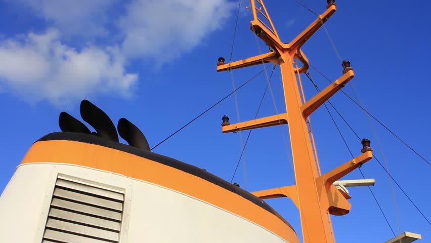 Chimney and mast of vintage diesel ship. Ship radar navigation system and
