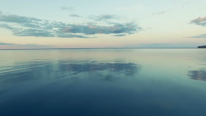 Panoramic Sunset Over Calm Lake Water Surface