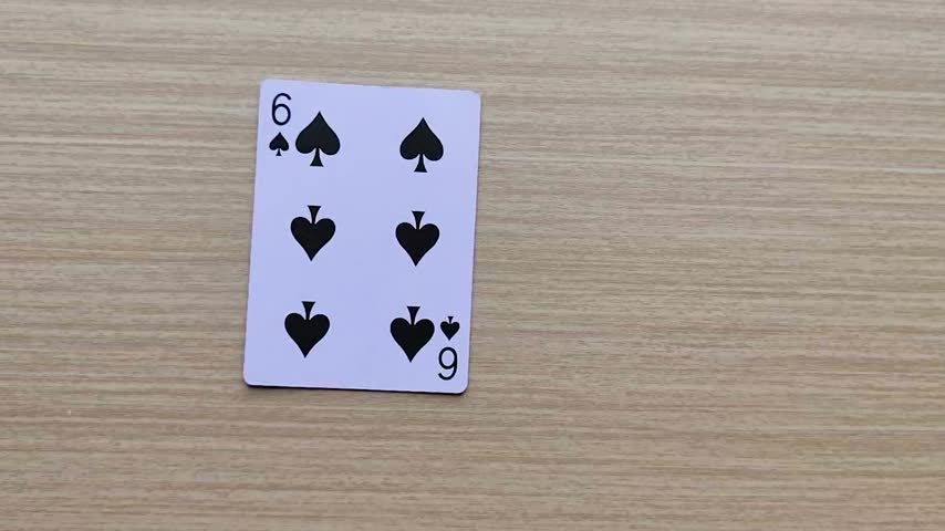 Dealing cards at the table, revealing the poker playing cards.