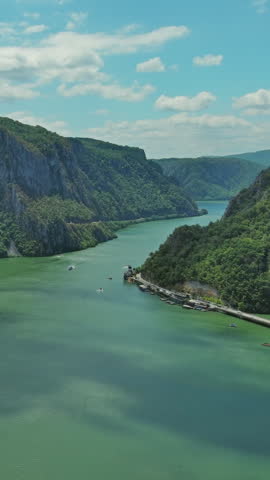 Aerial view on the Danube river and mountains in Iron Gate, Djerdap National Park, Serbia Romania border. Vertical video 4k