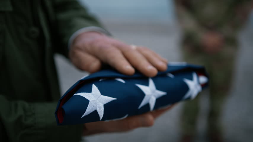 Veteran Soldier Caressing The USA Flag 