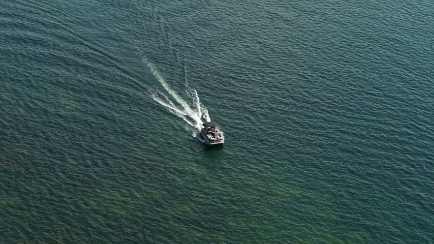 Drone View of Motorboat Sailing in Delavan Lake Wisconsin USA on Sunny Summer Day