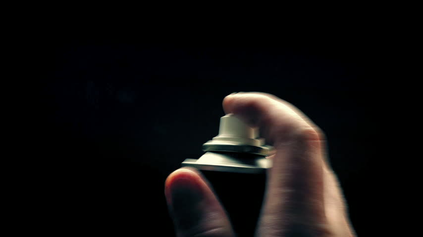 Person Uses Spray Paint Can