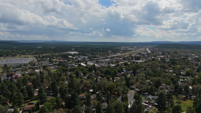 Aerial view of Flagstaff with a train moving through the scene, Flagstaff, Arizona, United States.