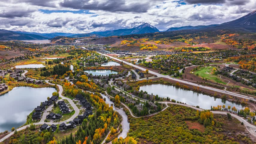 Aerial view of Silverthorne, Colorado, featuring lakes, autumn foliage, mountains, and residential areas in Silverthorne, Colorado, United States.