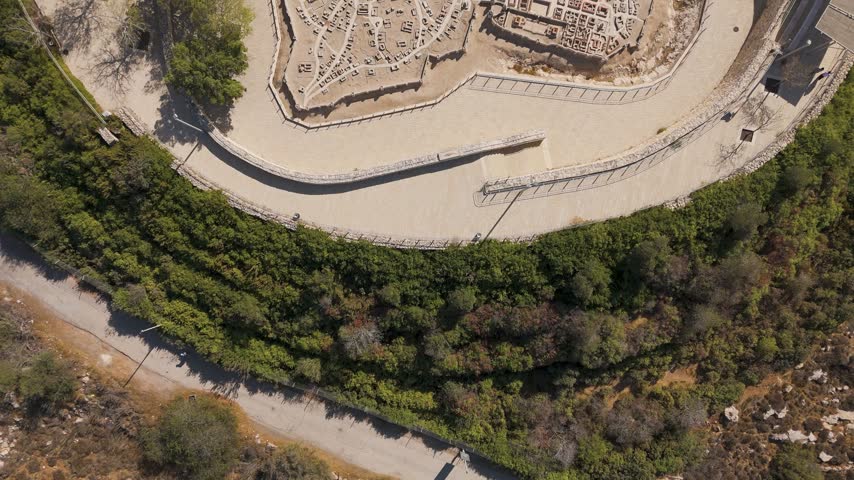 Aerial view of the Second Temple Model at The Israel Museum, featuring ancient stone structures and pathways surrounded by lush greenery in Jerusalem, Jerusalem District, Israel.
