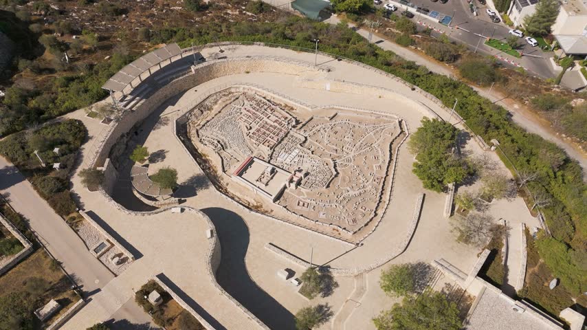 Aerial view of the Second Temple Model at The Israel Museum, featuring detailed ancient architecture and stone pathways surrounded by lush greenery in Jerusalem, Jerusalem District, Israel.